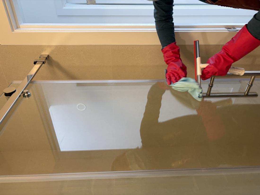 May squeegeeing a glass shower