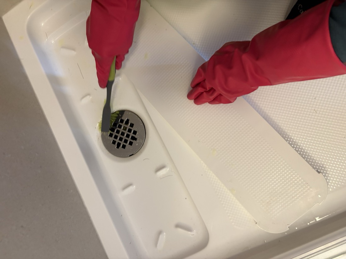 May scrubbing a shower drain